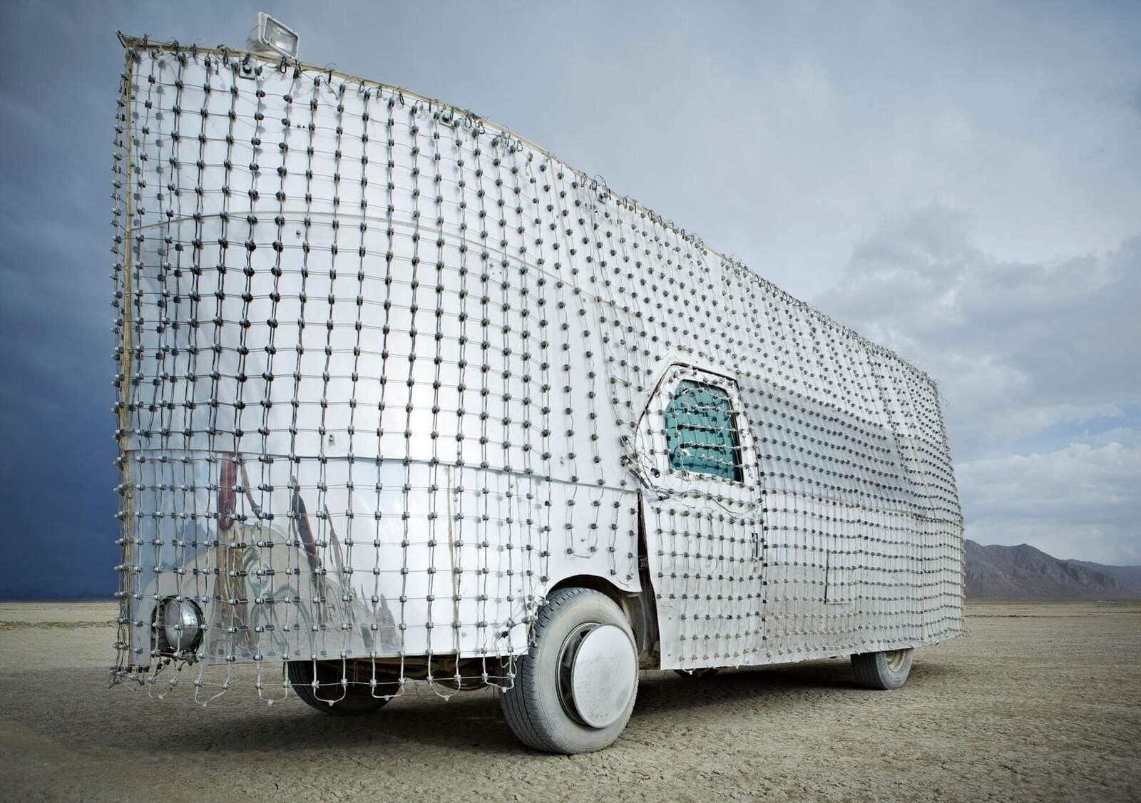 Daytime — LED pixel mesh over mirror skin, dual-identity day/night vehicle