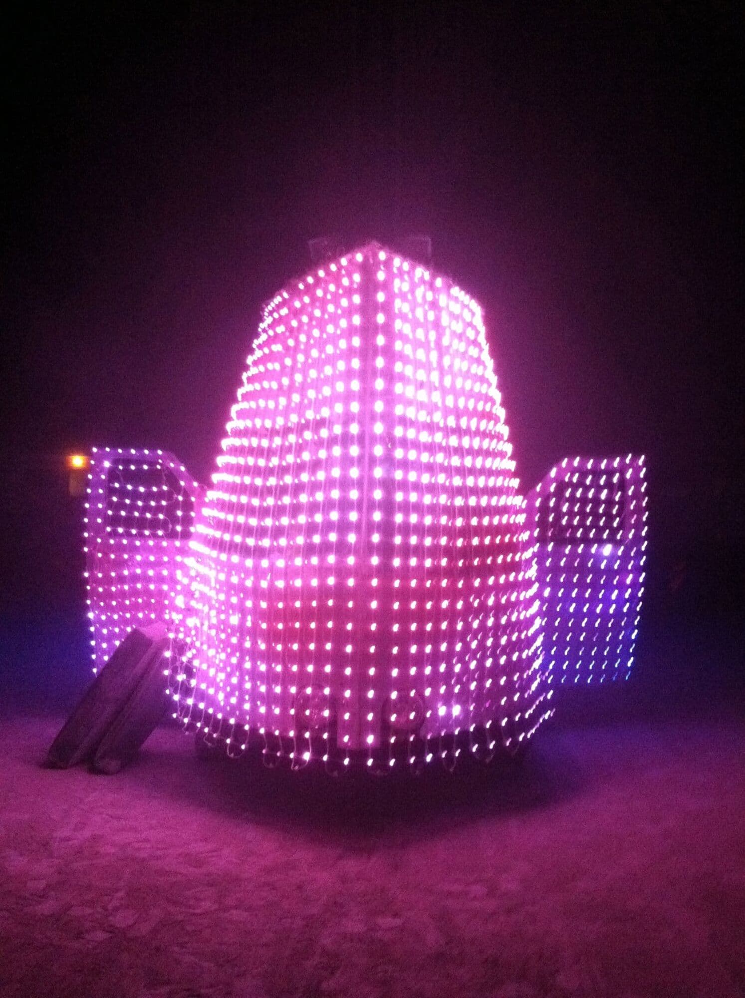 Night — full LED coverage from front, purple and pink generative content