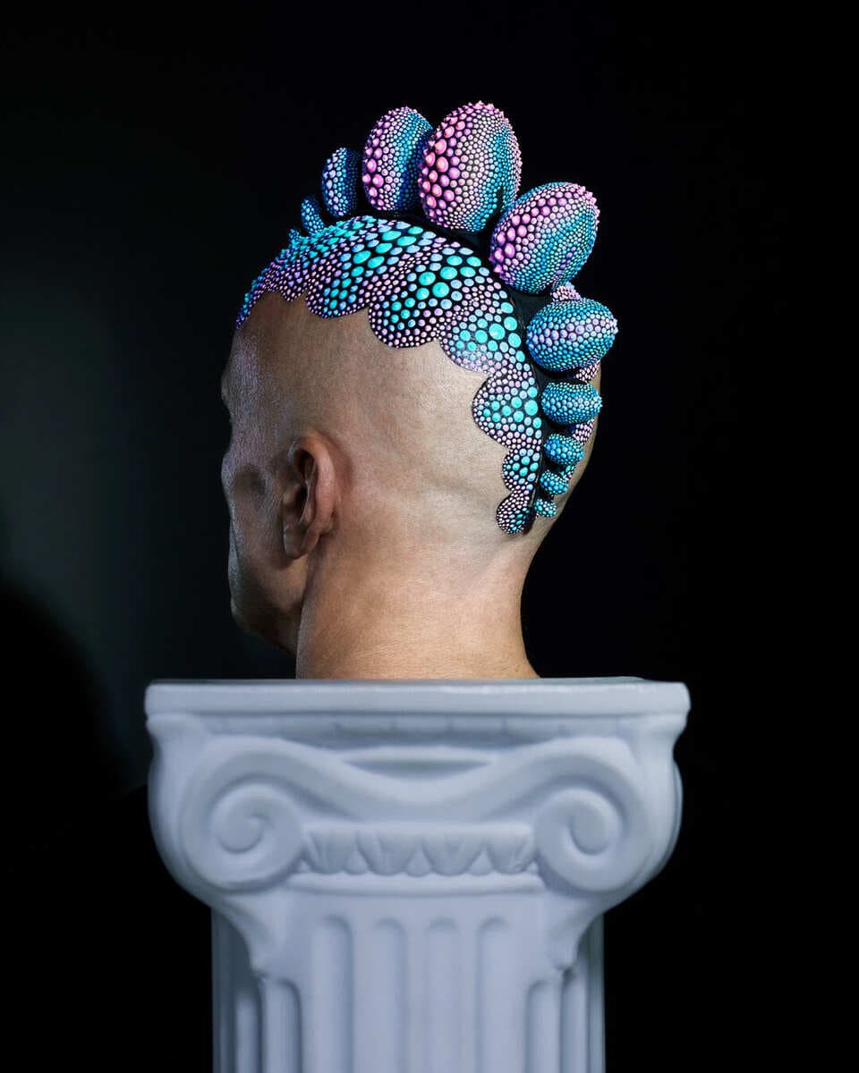 Iridescent headfin sculpture on model