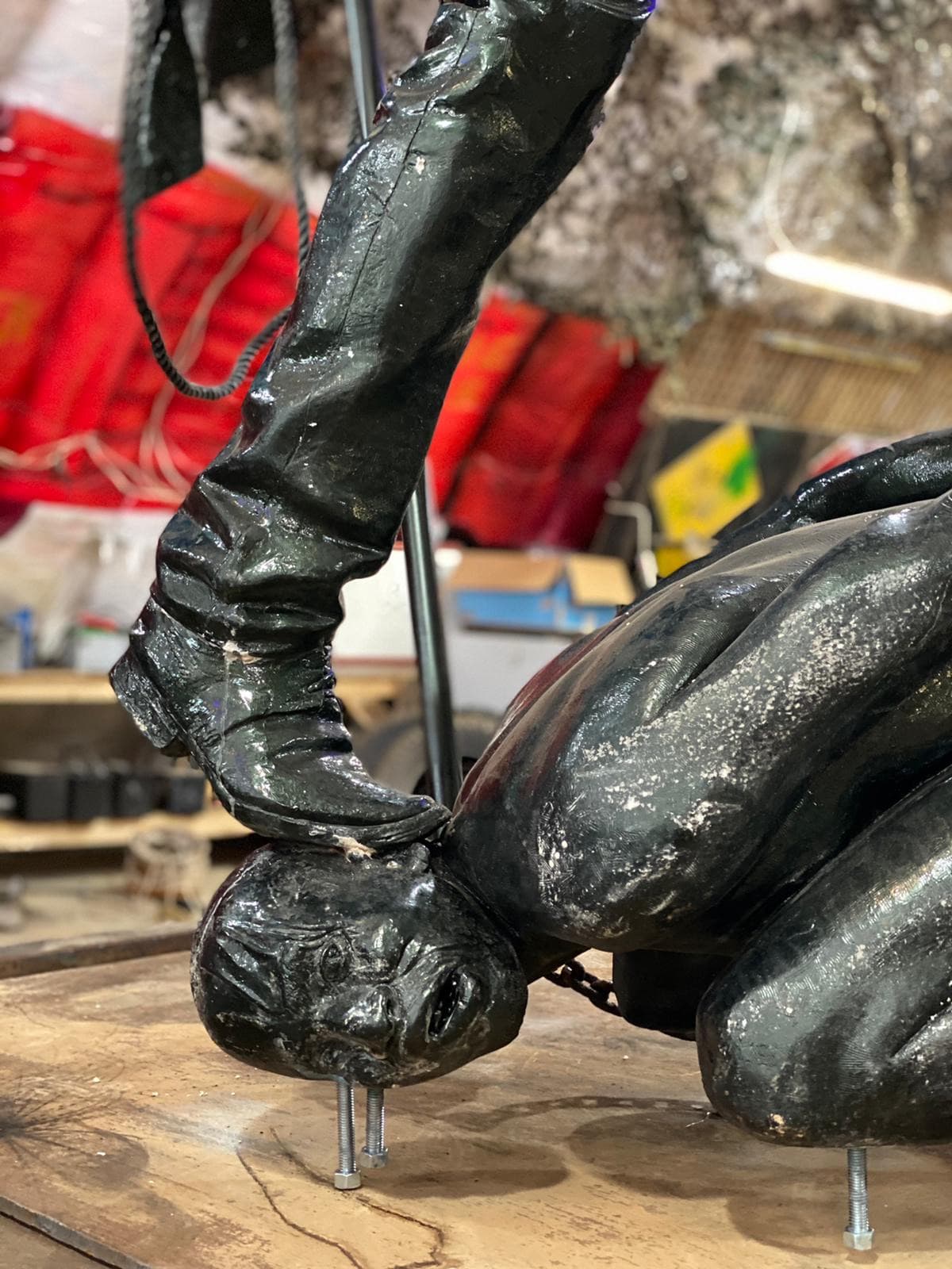 Boot on the head — the weight of oppression