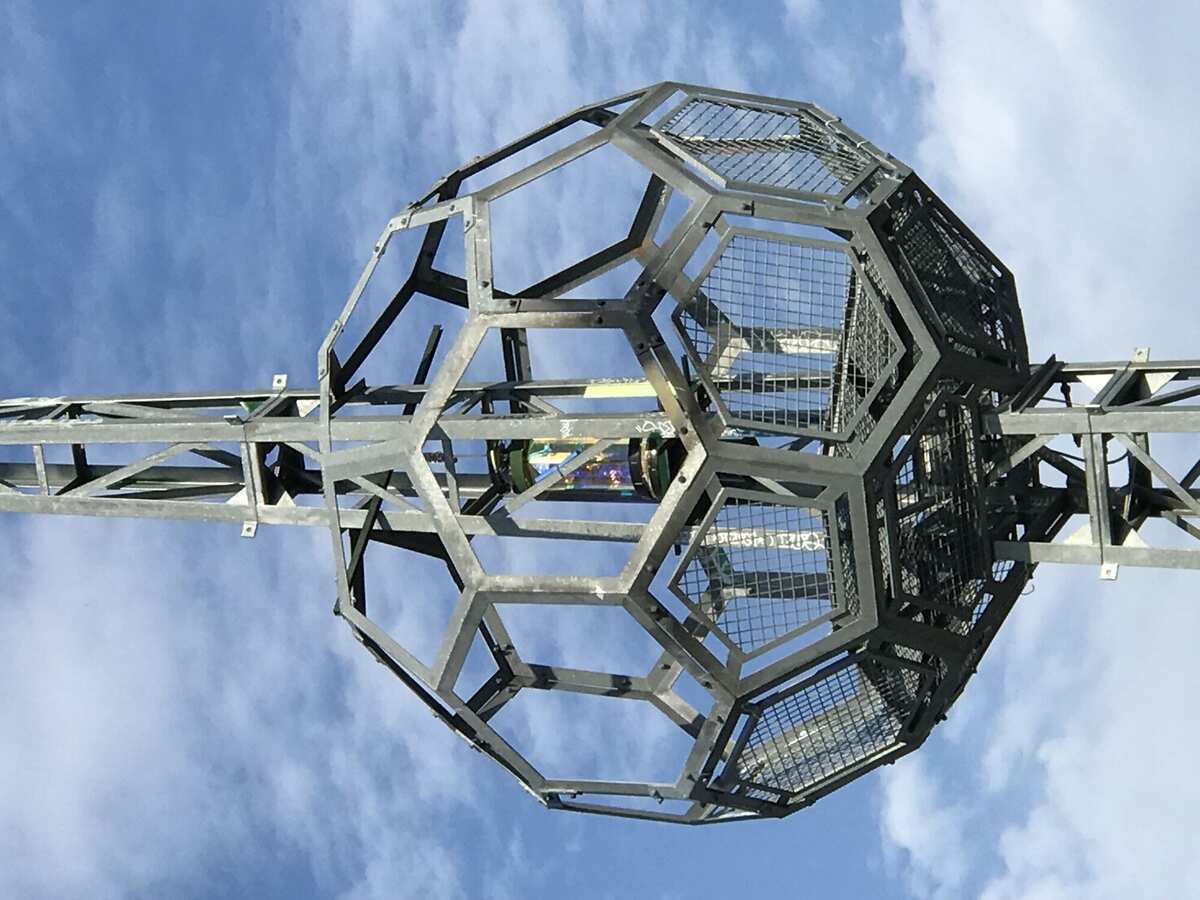 Buckyball head against blue sky
