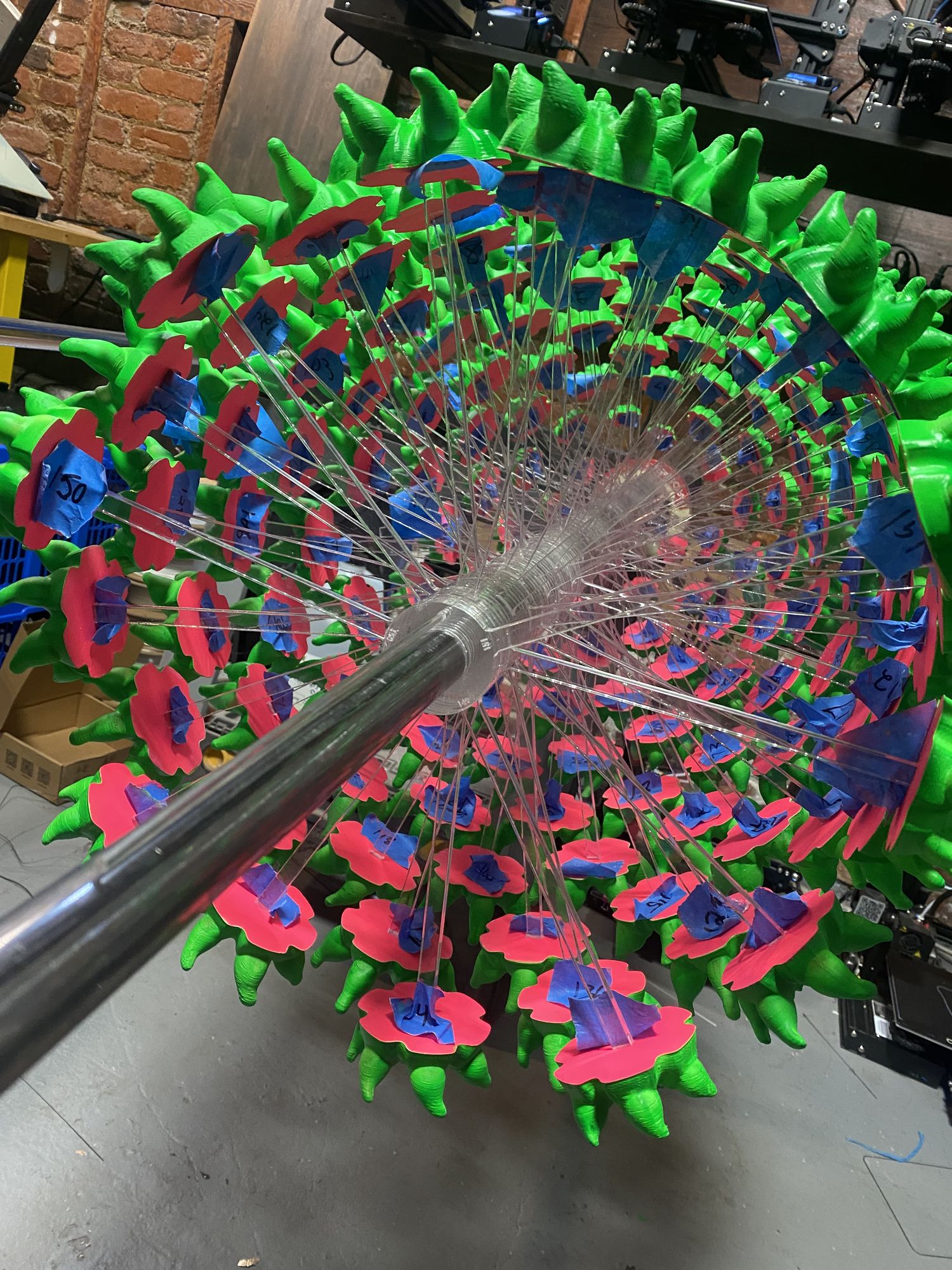 Zoetrope disc from above — spikes arrayed on the spindle